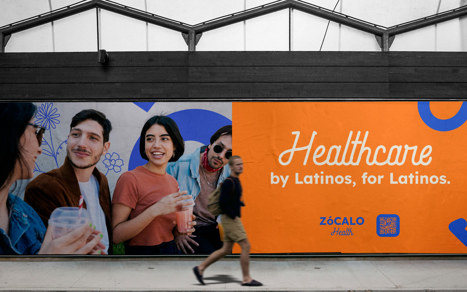Two people walk in front of a Zócalo Health out of home advertistment